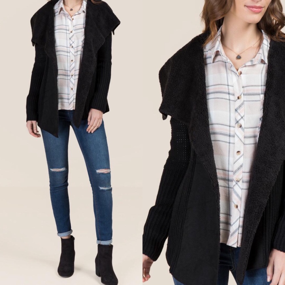 Francesca’s black “Kaylene Shearling Sweater”